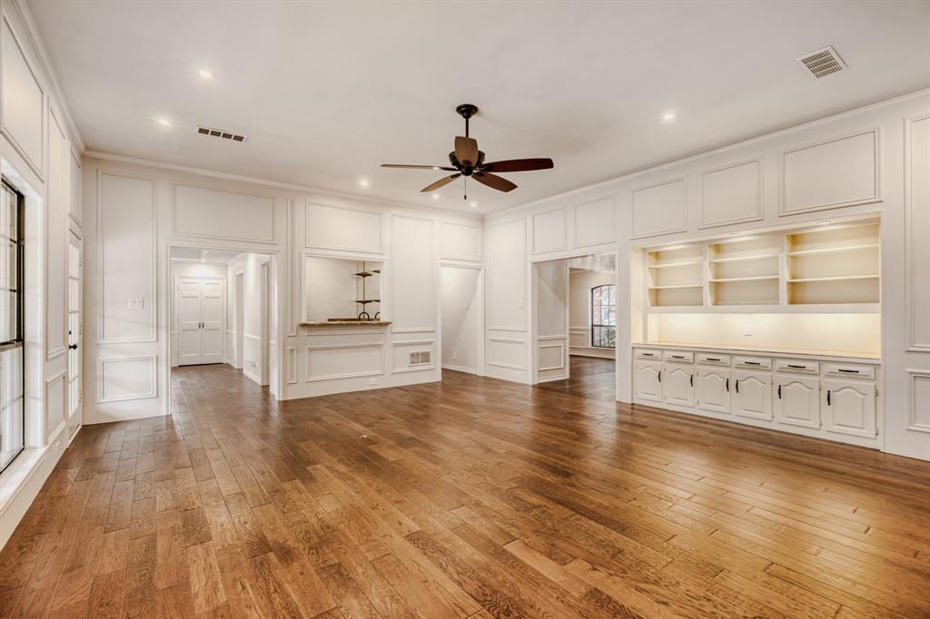 6108 Bluff Point Drive Dallas, TX 75248 - Photo 25 of 28 a view of an empty room with window and wooden floor
