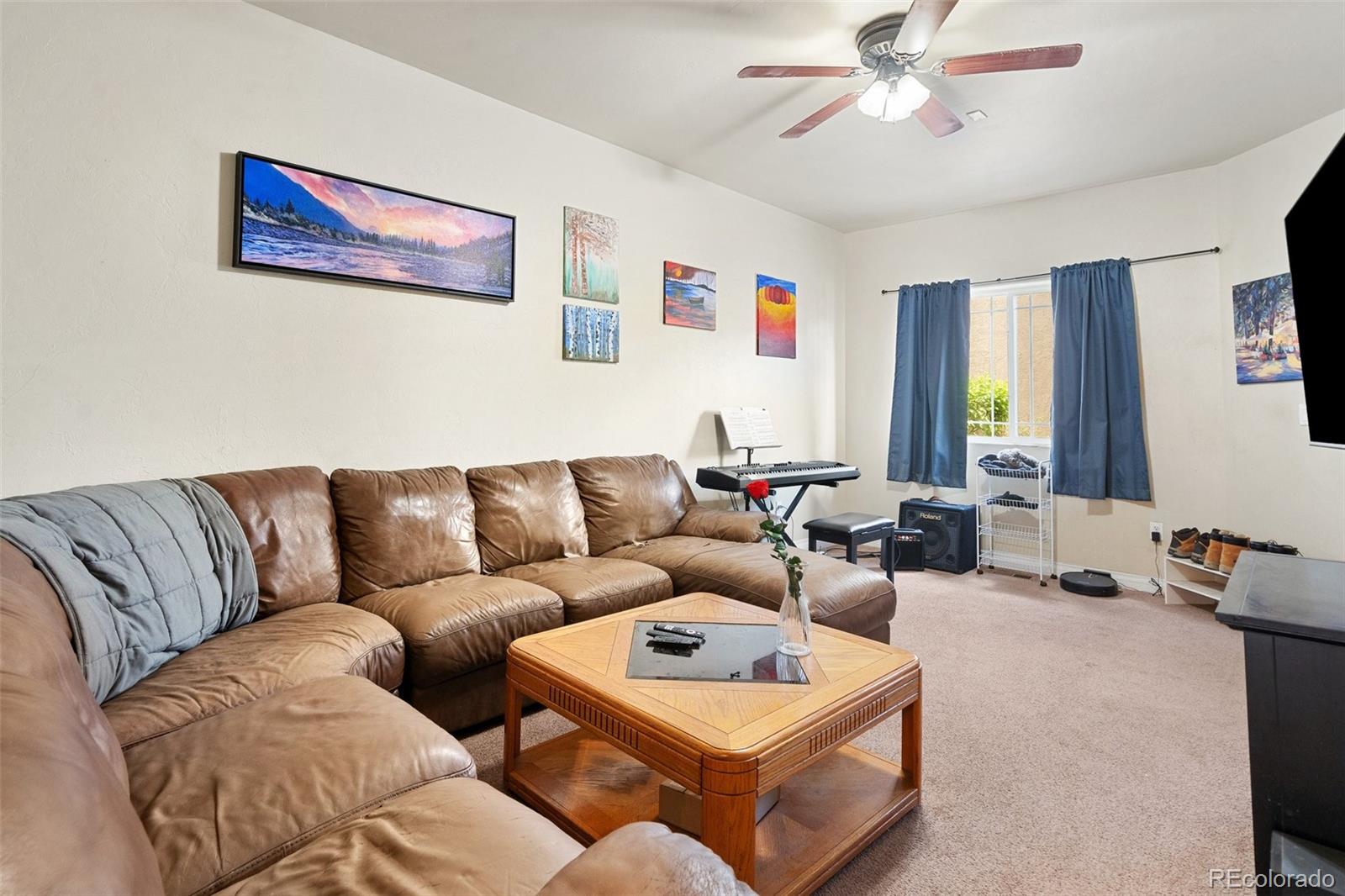 1510 York Road, Unit 101 Colorado Springs, CO 80918 - Photo 2 of 12 a living room with furniture ceiling fan and a window