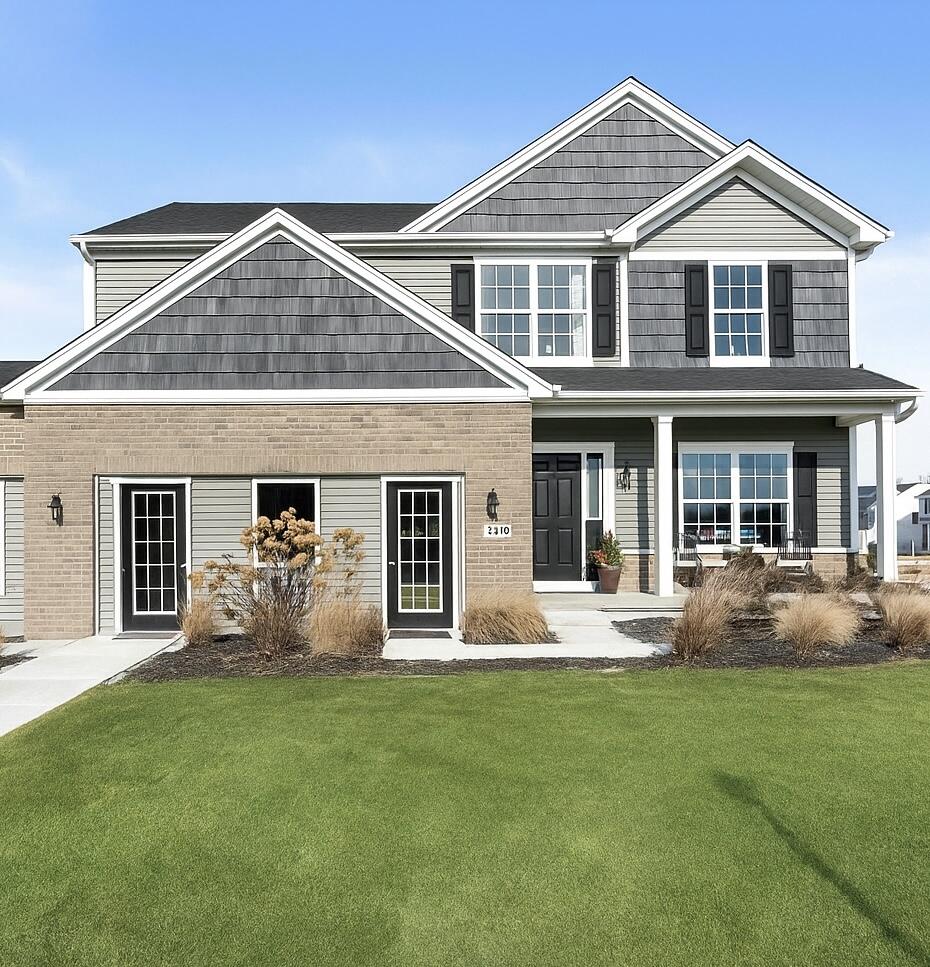 front view of a house with a yard