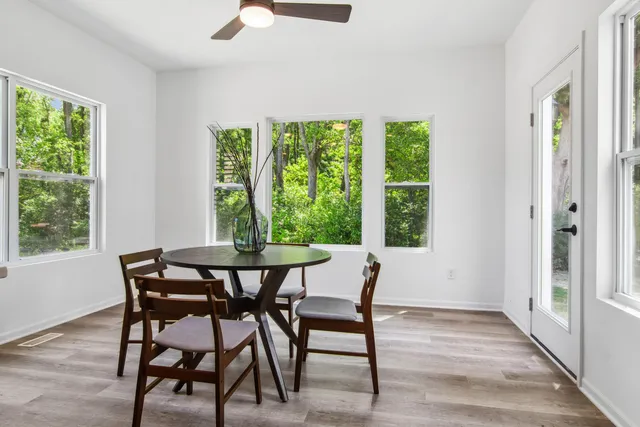 a view of a dining room with furniture window and outside view