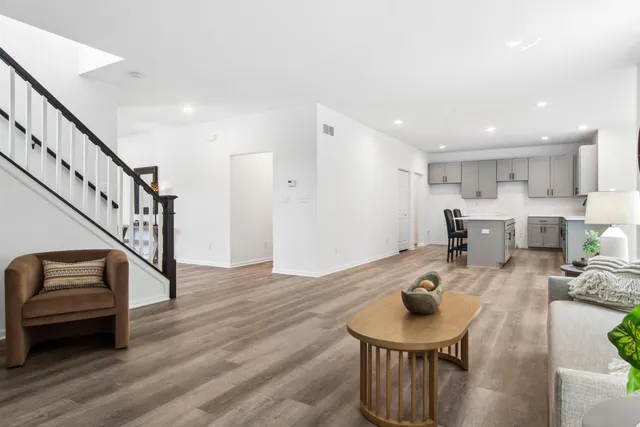 a living room with furniture and a table