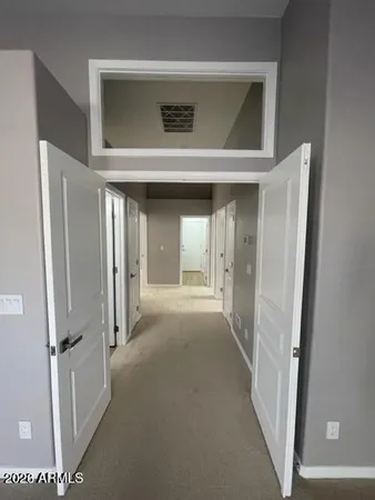 a view of a hallway with closet