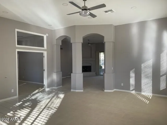 a view of livingroom with hardwood floor and ceiling fan