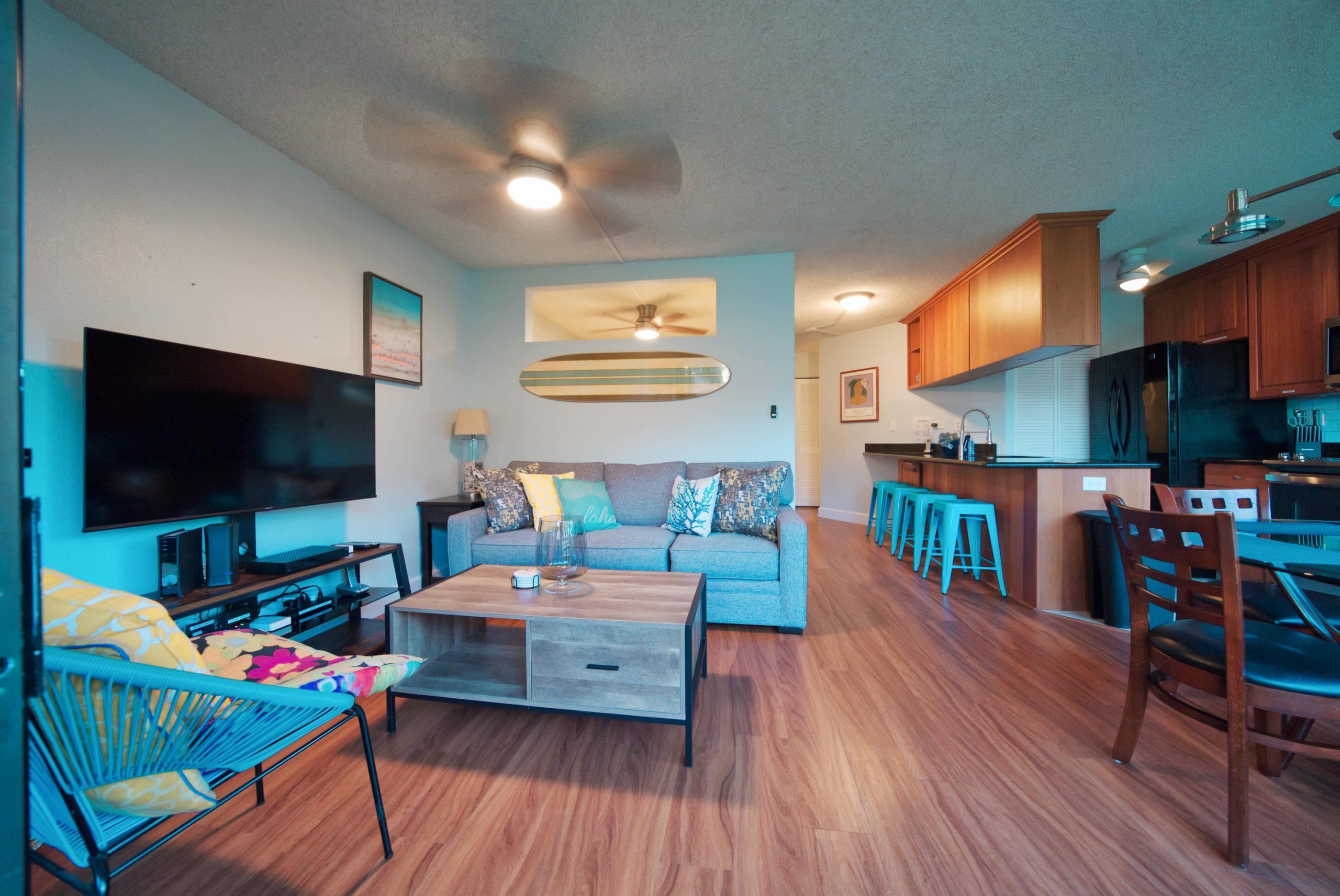 1032 South Kihei Road, Unit A201 Kihei, HI 96753 - Photo 1 of 23 a bedroom with furniture and a flat screen tv