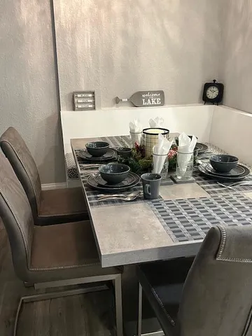 a kitchen with a table and chairs
