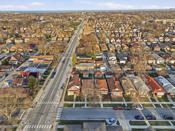 an aerial view of a residential apartment building with a yard