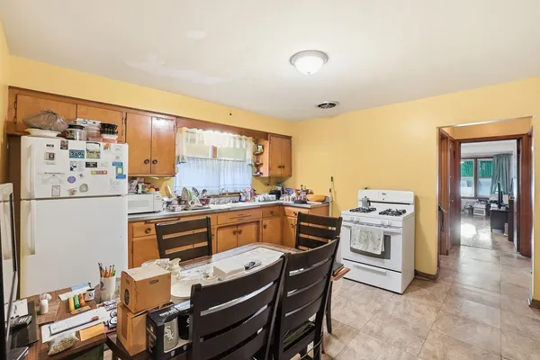 a kitchen with stainless steel appliances kitchen island granite countertop a sink and cabinets