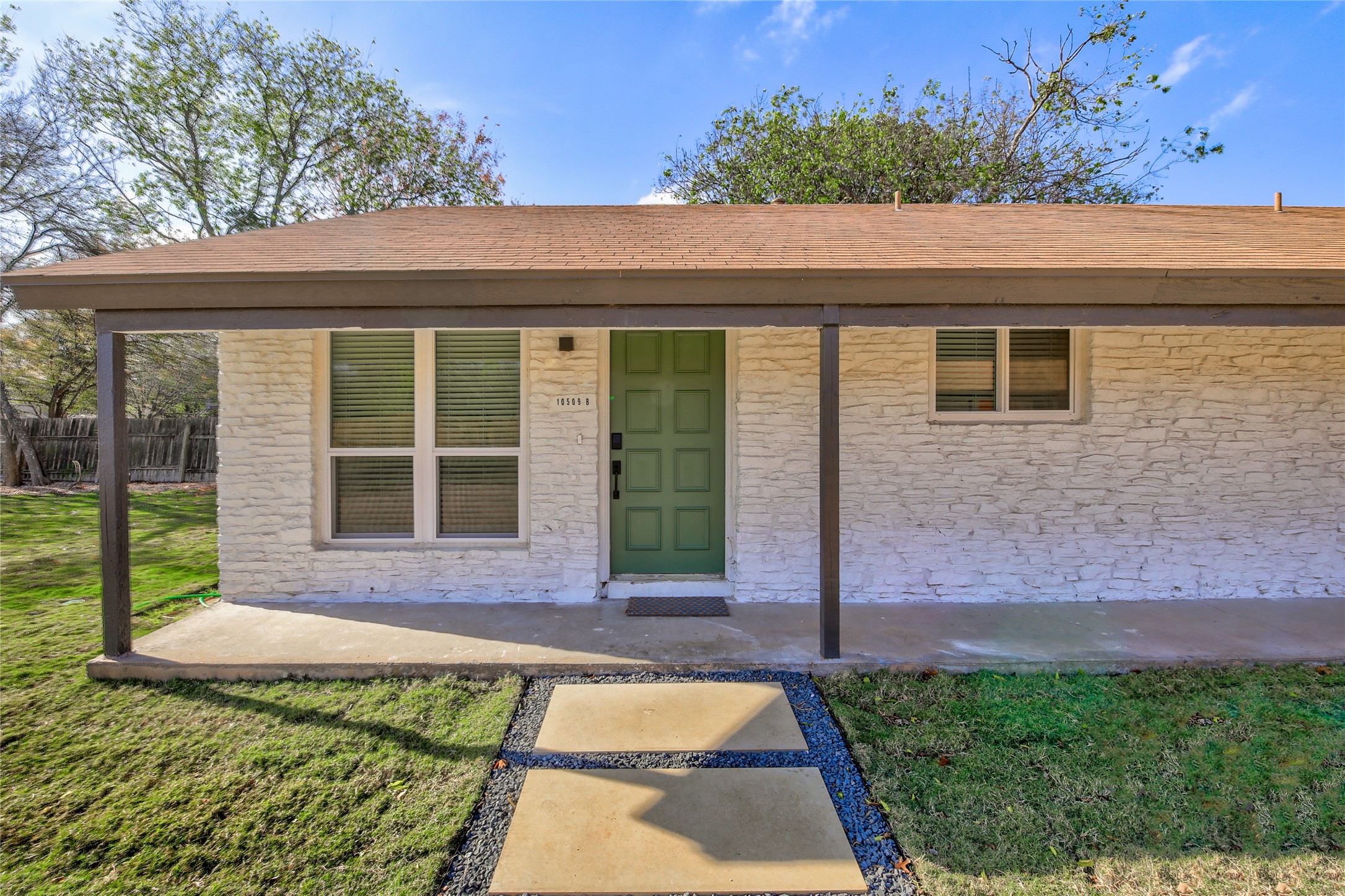 10509 Macmora Road, Unit B Austin, TX 78758 - Photo 2 of 19 a front view of a house with a yard