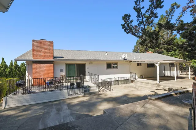 a view of a house with wooden floor and outdoor space