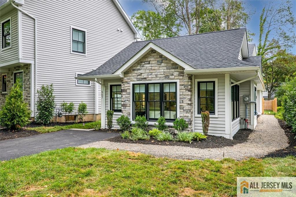 567 Riverside Drive Princeton, NJ 08540 - Photo 3 of 33 a view of front of house with potted plants