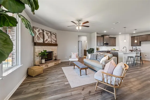 a living room with furniture and kitchen view
