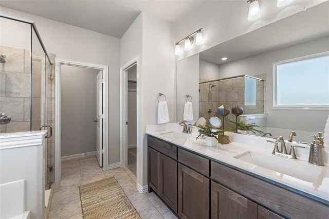a bathroom with a double vanity sink mirror and double