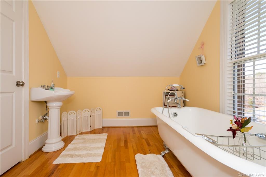223 Beaten Path Road Mooresville, NC 28117 - Photo 17 of 24 a bathroom with a tub and sink
