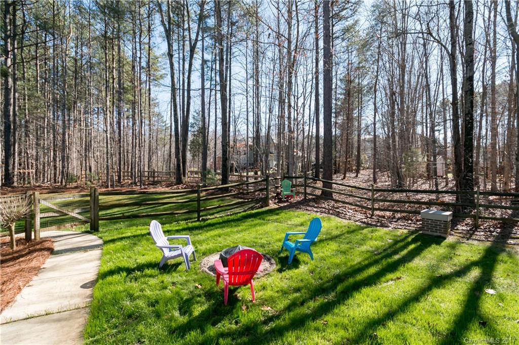 223 Beaten Path Road Mooresville, NC 28117 - Photo 21 of 24 a backyard of a house with table and chairs