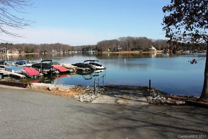 223 Beaten Path Road Mooresville, NC 28117 - Photo 23 of 24 a view of a lake with a car parked