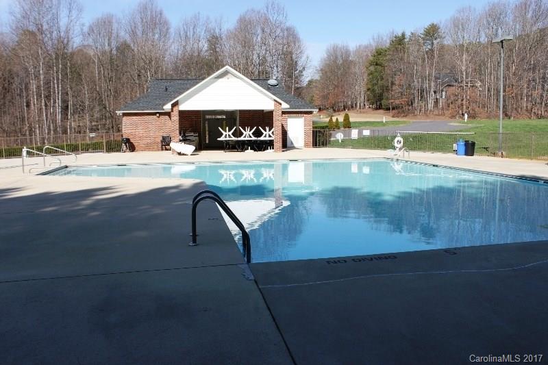 223 Beaten Path Road Mooresville, NC 28117 - Photo 24 of 24 a swimming pool with outdoor seating and yard in the back