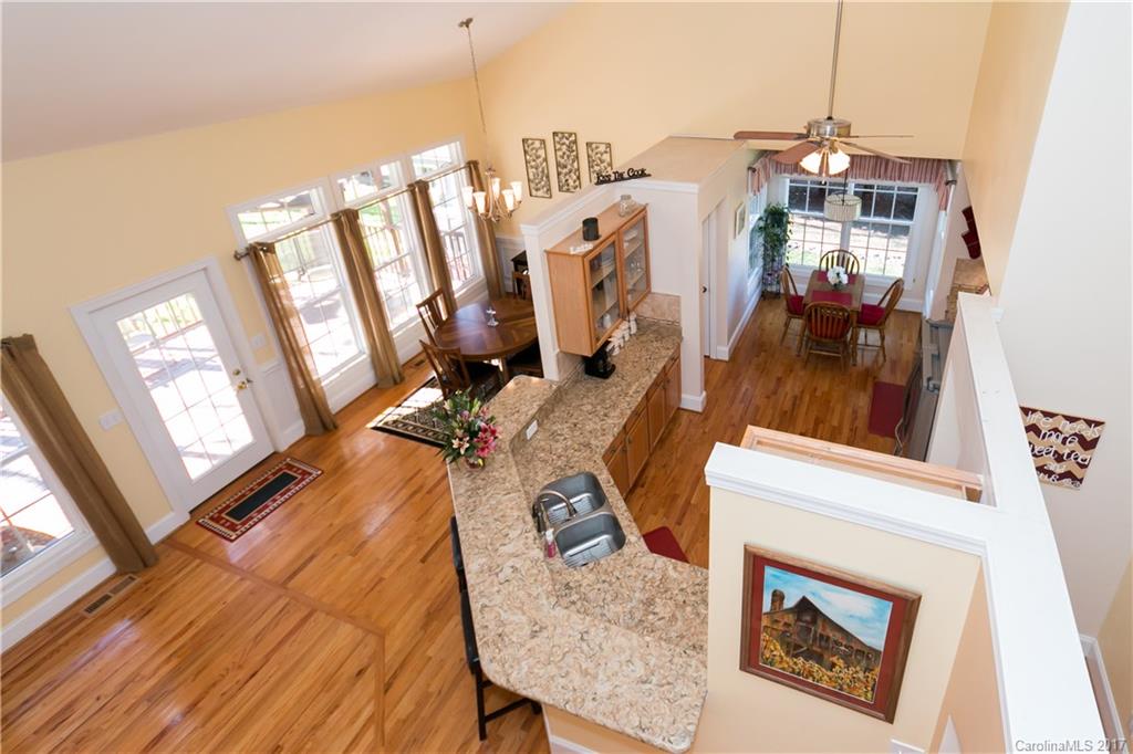 223 Beaten Path Road Mooresville, NC 28117 - Photo 6 of 24 a view of a living room with furniture and a fireplace
