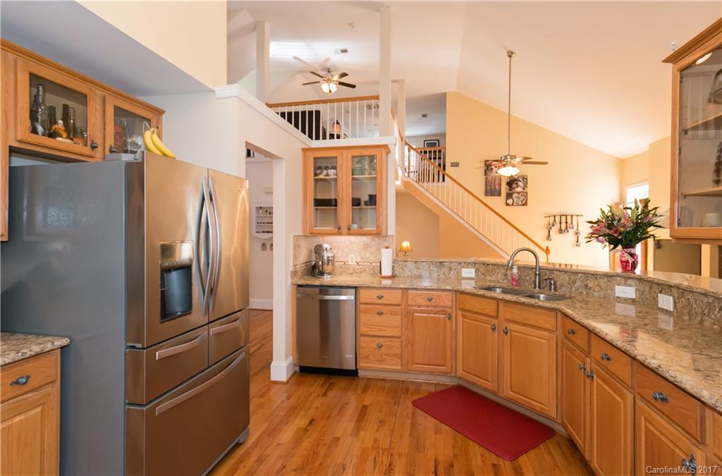 223 Beaten Path Road Mooresville, NC 28117 - Photo 7 of 24 a kitchen with stainless steel appliances granite countertop a refrigerator a sink and dishwasher