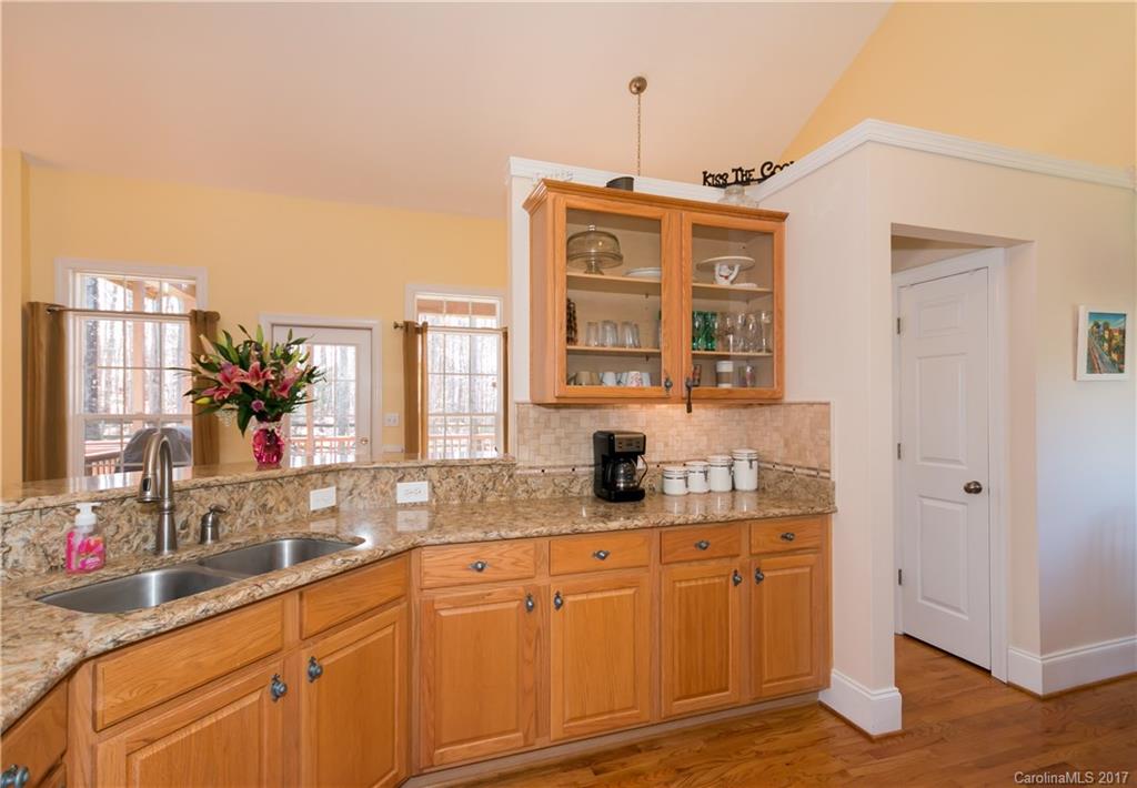 223 Beaten Path Road Mooresville, NC 28117 - Photo 8 of 24 a bathroom with a sink and a mirror