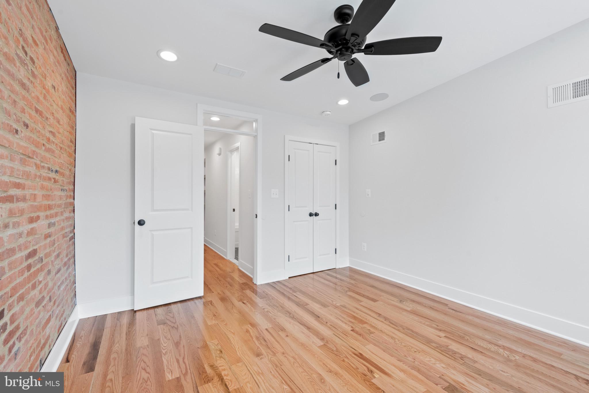 1434 Marshall Street Baltimore, MD 21230 - Photo 22 of 40 wooden floor in an empty room with a window