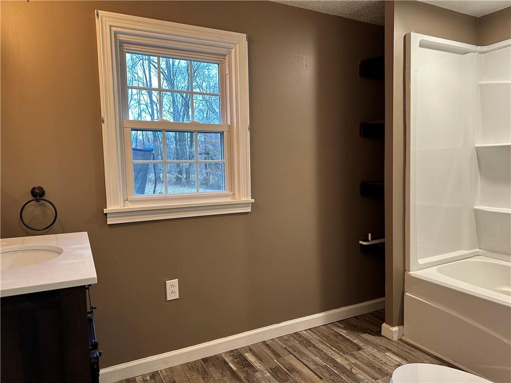 15 Kyle Road Mercer, PA 16137 - Photo 6 of 11 a view of a bathroom with a sink and a bath tub