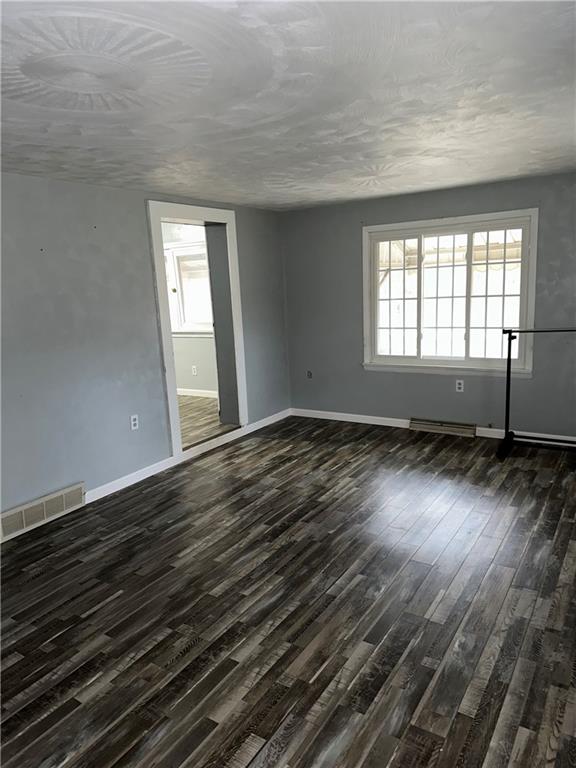 15 Kyle Road Mercer, PA 16137 - Photo 8 of 11 a view of empty room with wooden floor