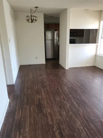 a view of a livingroom with wooden floor