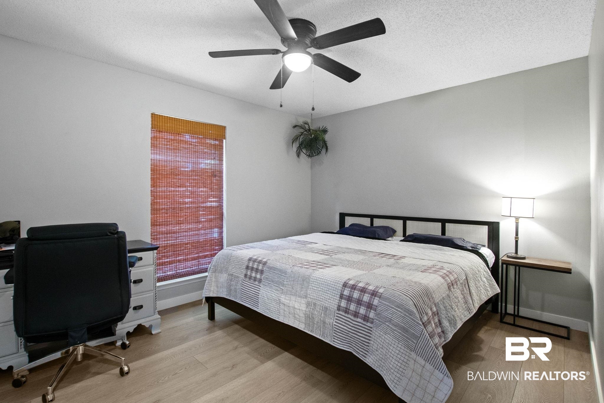 524 Ariel Avenue Foley, AL 36535 - Photo 20 of 37 Bedroom featuring wood-finish flooring, a ceiling fan with integrated lighting, and a window with a woven wood blind