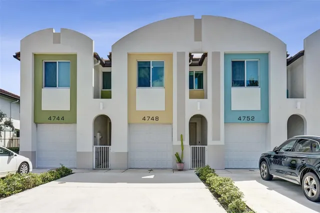 a front view of a house with parking
