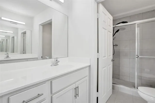 a bathroom with a shower and toilet