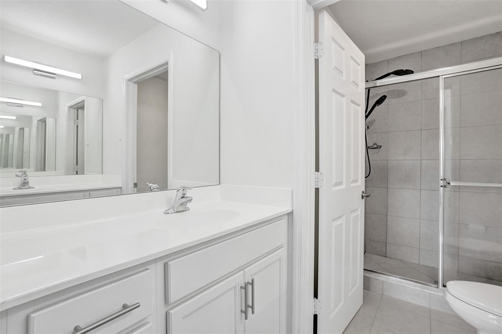 4748 Southwest 63rd Terrace, Unit 4748 Davie, FL 33314 - Photo 16 of 31 a bathroom with a sink and a mirror