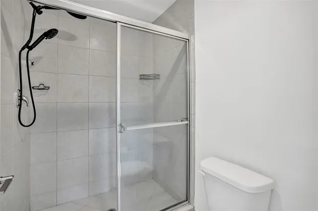 a bathroom with a sink toilet and mirror