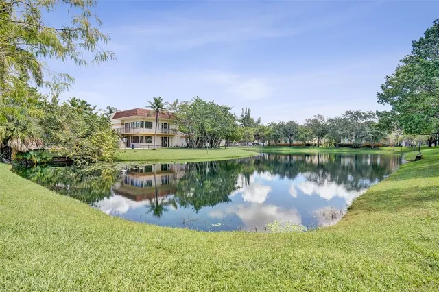 a view of a lake with a house in the background