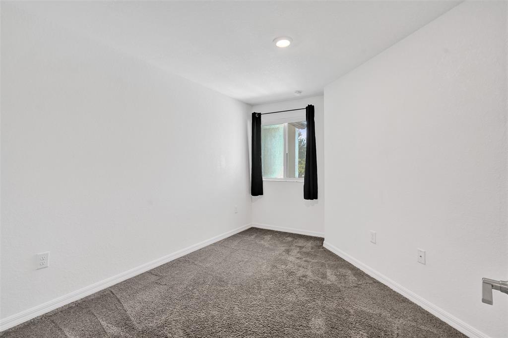 4748 Southwest 63rd Terrace, Unit 4748 Davie, FL 33314 - Photo 22 of 31 an empty room with windows