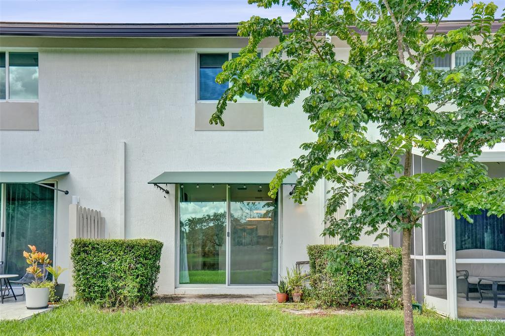 4748 Southwest 63rd Terrace, Unit 4748 Davie, FL 33314 - Photo 25 of 31 a house with a tree in front of it