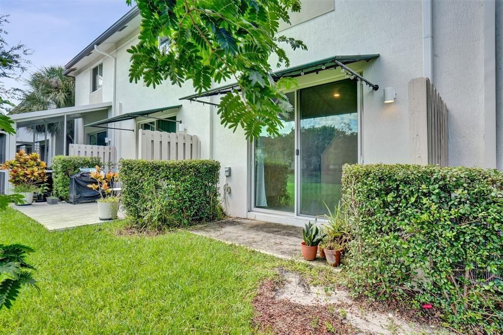 4748 Southwest 63rd Terrace, Unit 4748 Davie, FL 33314 - Photo 28 of 31 a front view of a house with garden