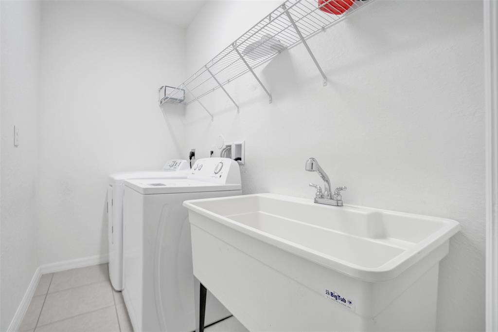 4748 Southwest 63rd Terrace, Unit 4748 Davie, FL 33314 - Photo 30 of 31 a bathroom with a sink and a mirror