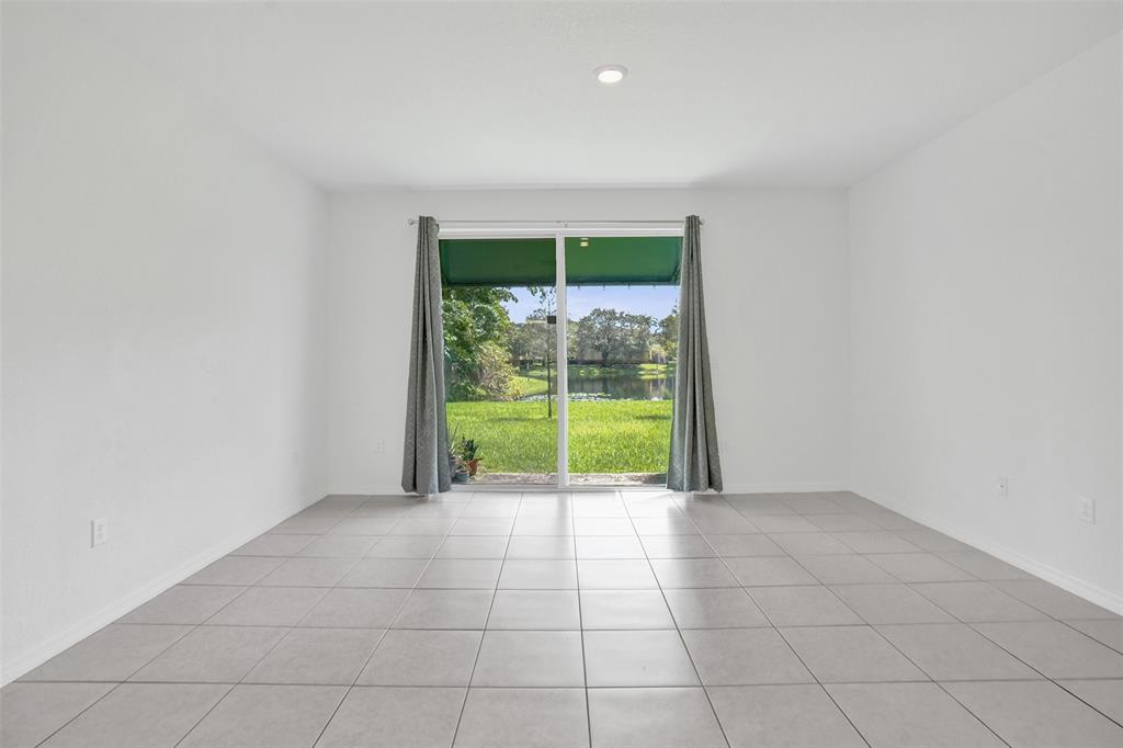 4748 Southwest 63rd Terrace, Unit 4748 Davie, FL 33314 - Photo 5 of 31 a view of an empty room with a window