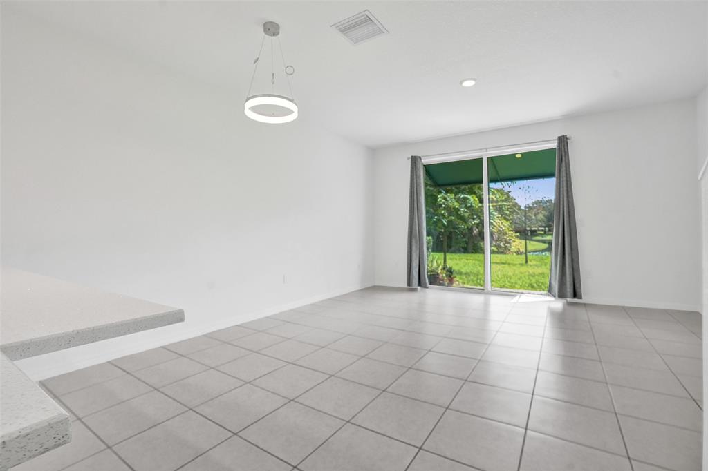 4748 Southwest 63rd Terrace, Unit 4748 Davie, FL 33314 - Photo 6 of 31 a view of an empty room with a window
