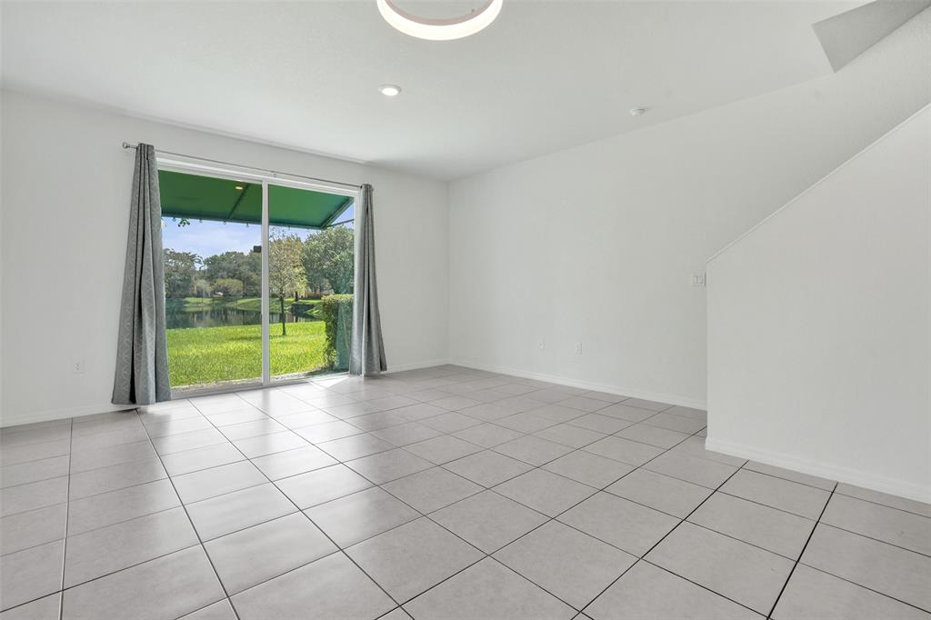 4748 Southwest 63rd Terrace, Unit 4748 Davie, FL 33314 - Photo 7 of 31 a view of an empty room with a window
