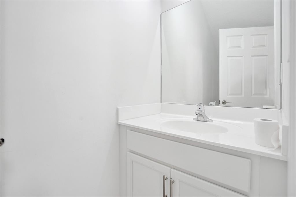 4748 Southwest 63rd Terrace, Unit 4748 Davie, FL 33314 - Photo 9 of 31 a bathroom with a sink and a mirror