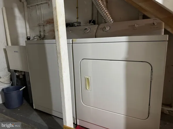 a close view of a sink and refrigerator