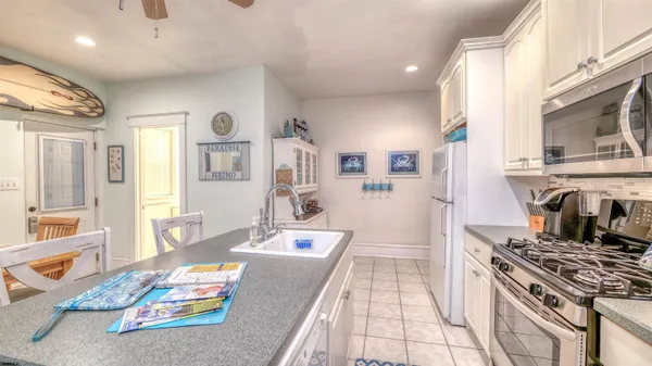 a kitchen with stainless steel appliances granite countertop a stove and a sink