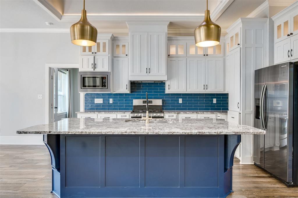 2830 Juniper Lane Tyler, TX 75701 - Photo 11 of 34 a kitchen with stainless steel appliances granite countertop a sink a stove and refrigerator