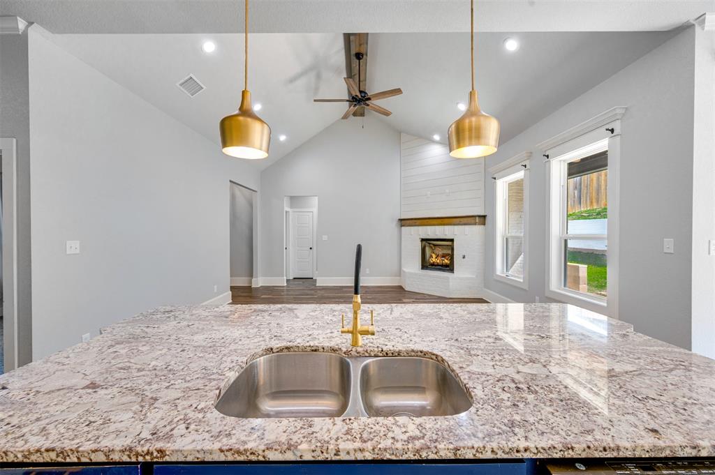 2830 Juniper Lane Tyler, TX 75701 - Photo 14 of 34 a kitchen with a sink a counter space cabinets and appliances
