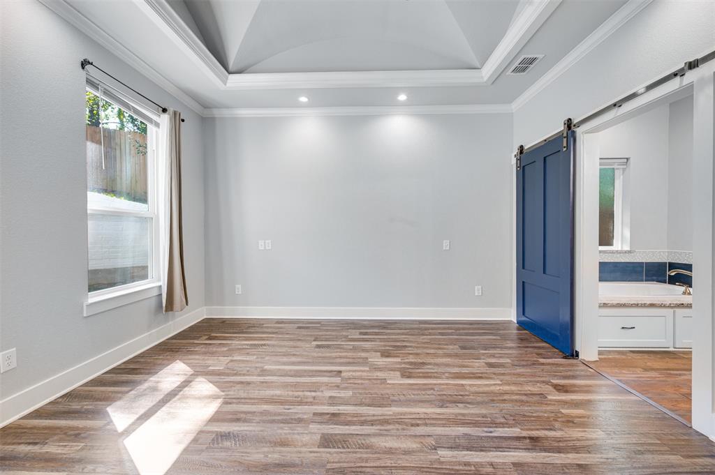 2830 Juniper Lane Tyler, TX 75701 - Photo 17 of 34 wooden floor in an empty room with a window