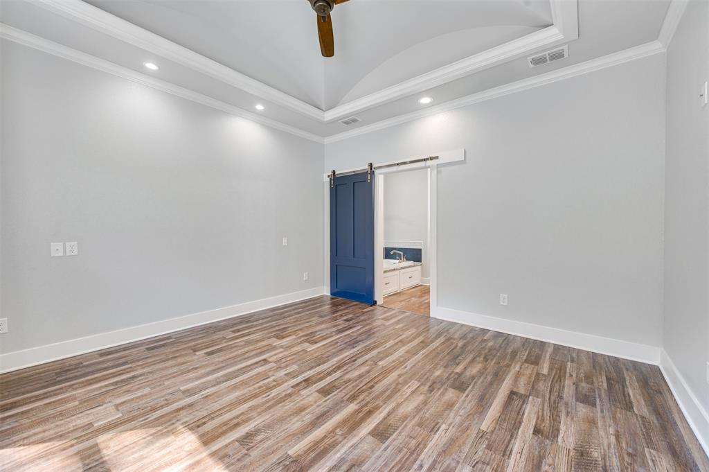 2830 Juniper Lane Tyler, TX 75701 - Photo 18 of 34 a view of an empty room with wooden floor