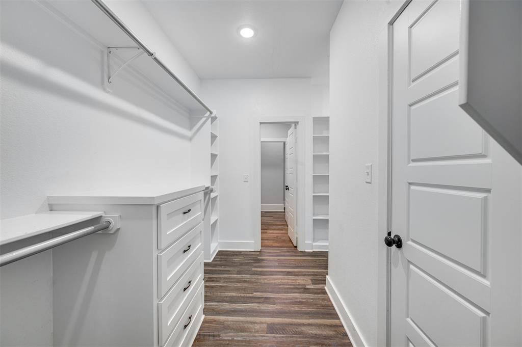 2830 Juniper Lane Tyler, TX 75701 - Photo 21 of 34 a view of a hallway with white walls and stairs