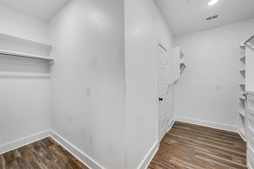 2830 Juniper Lane Tyler, TX 75701 - Photo 22 of 34 a view of a room with wooden floor and white walls
