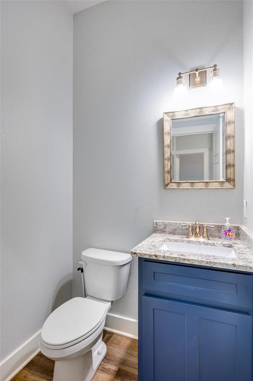 2830 Juniper Lane Tyler, TX 75701 - Photo 27 of 34 a bathroom with a toilet sink and mirror